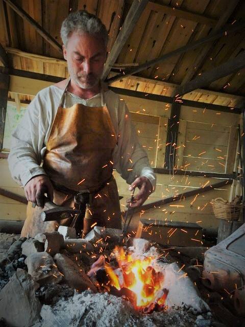 Blacksmithing with bellows