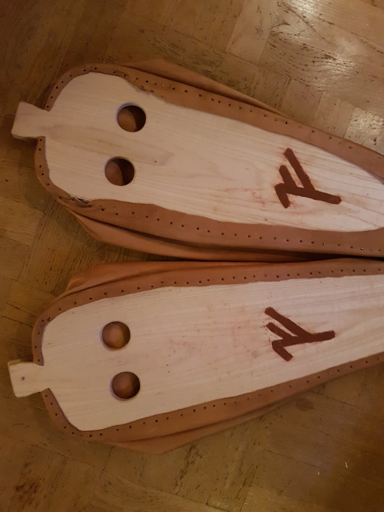 The under-side vents. The inside leather backdraft locks can barely be seen. The hole in the fastening tab can also be seen.